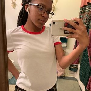 white top with red sleeves